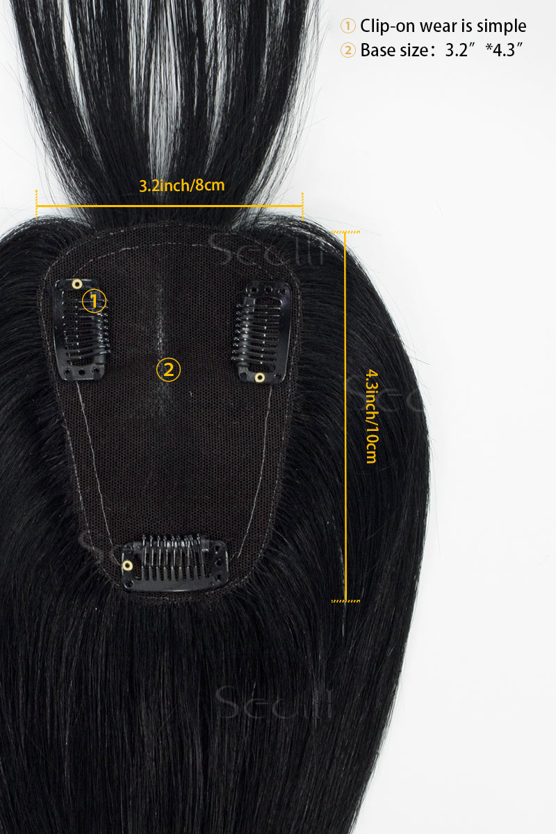 A mannequin head showcasing a dark black human hair topper with bangs.