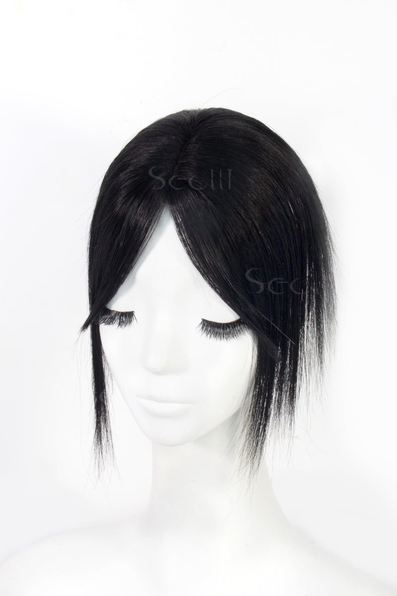 A mannequin head showcasing a dark black human hair topper with bangs.