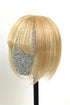 A handmade human hair topper with bangs, displayed on a mannequin head, featuring warm blonde color with highlights.