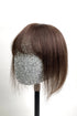 A mannequin head showcasing a medium brown human hair topper with bangs.