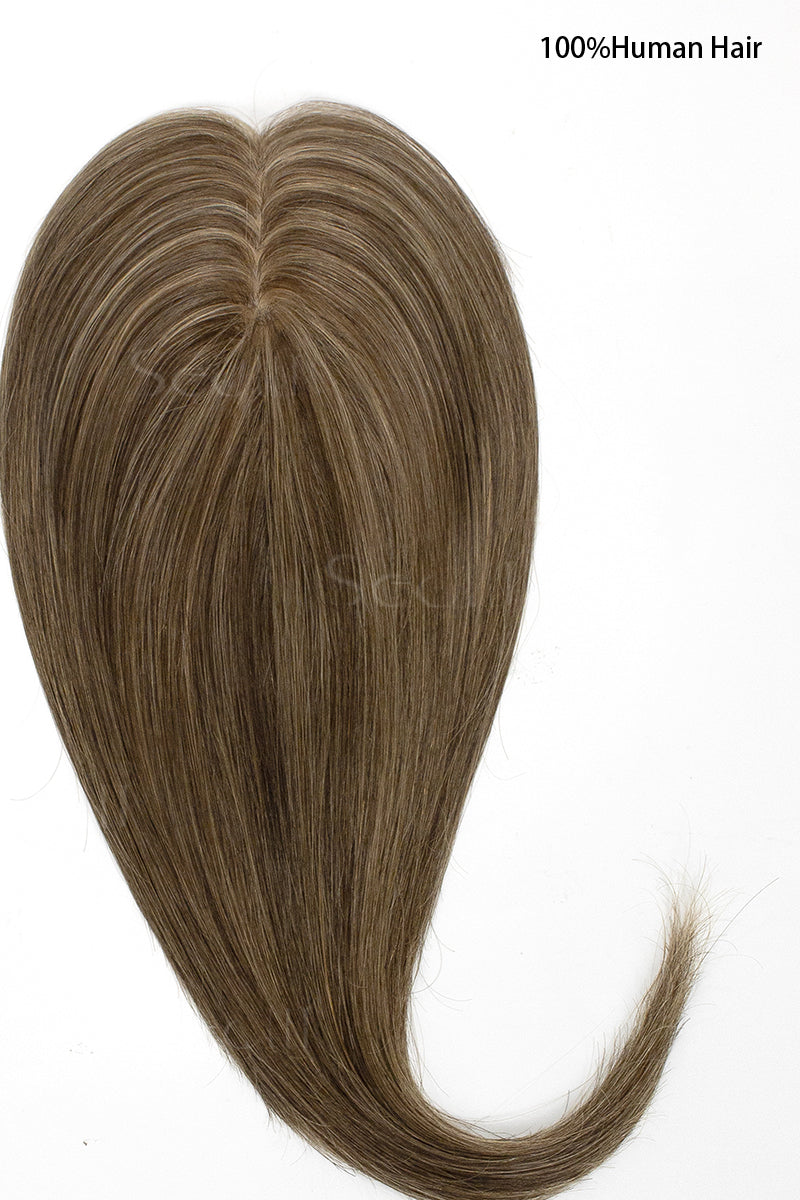 Brown hairpiece labeled &