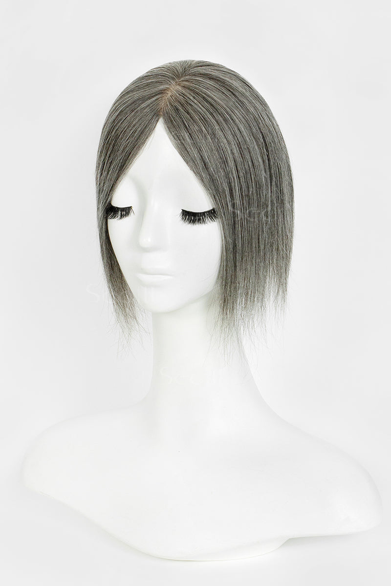 Medium grey hair topper styled into a straight center-parted bob on a white mannequin.