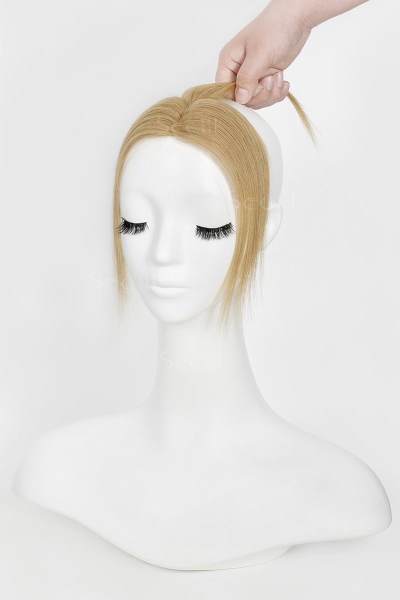 Mannequin head with Magic Pixie Topper Dark Blonde