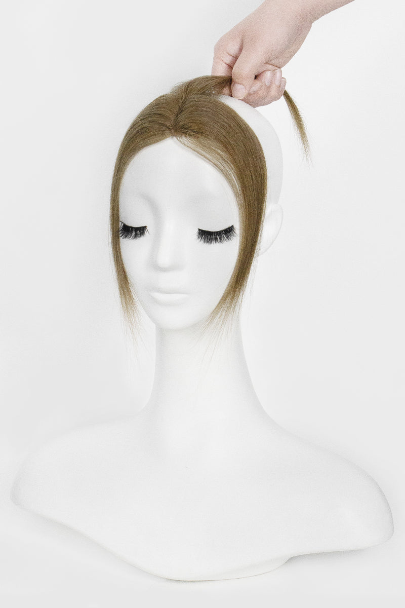 Mannequin head with a Magic Pixie Topper Light Chestnut Brown