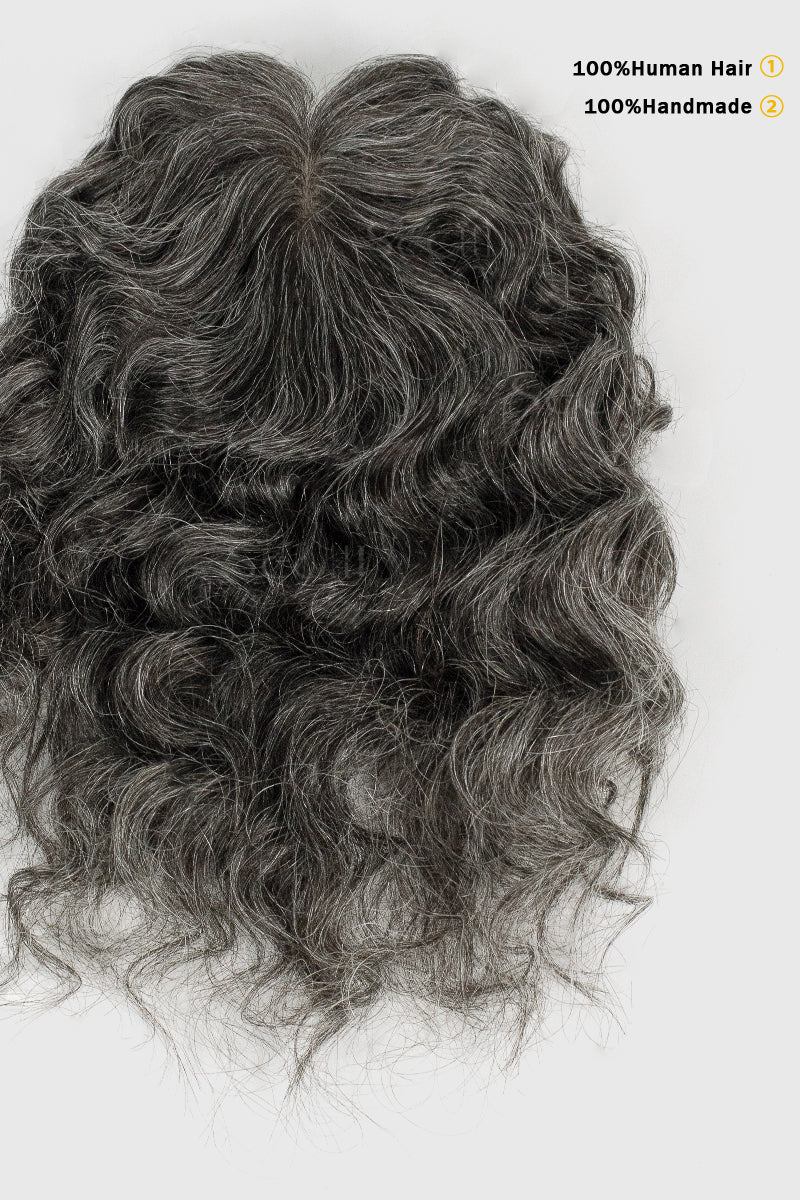 Gray wavy hairpiece on a white background with text indicating 100% human hair and 100% handmade.