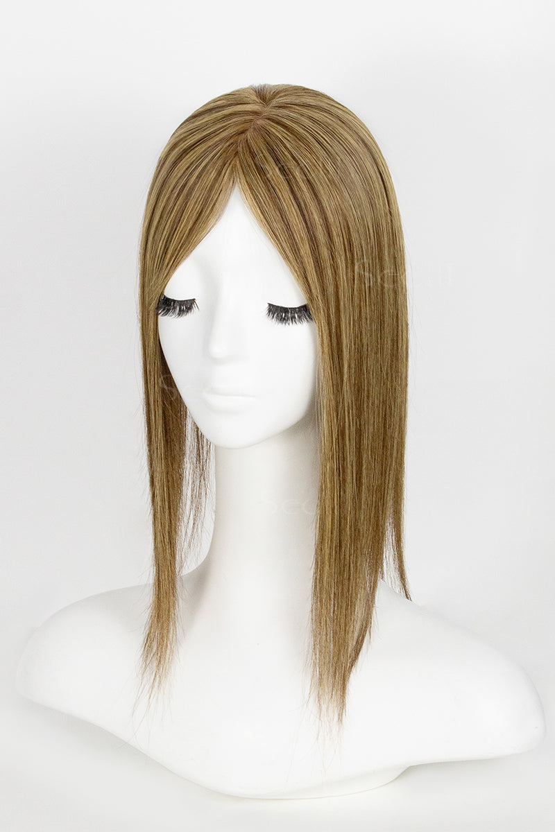 Mannequin head with a brown wig on a white background