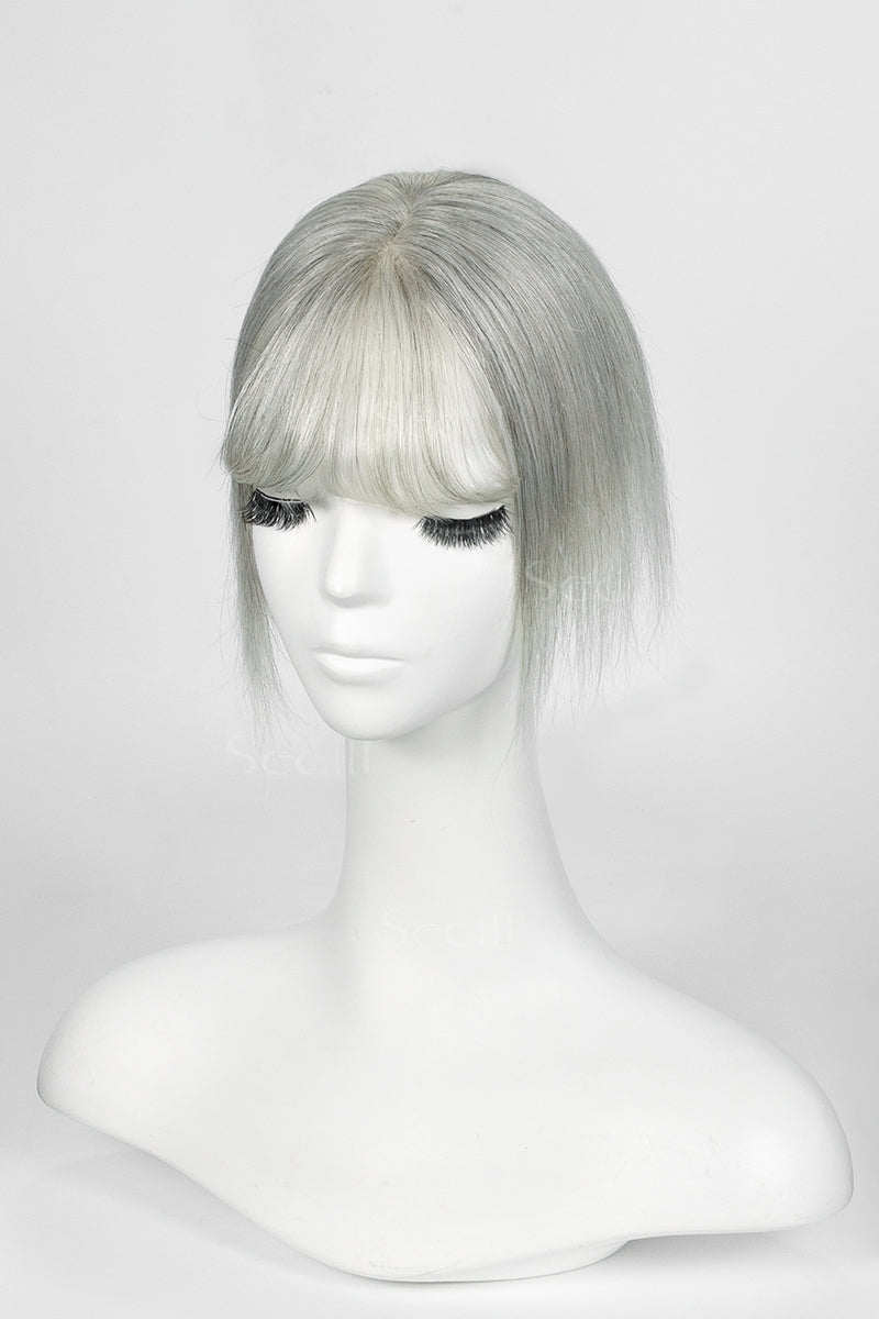 Light Grey topper with bangs on a mannequin head against a white background