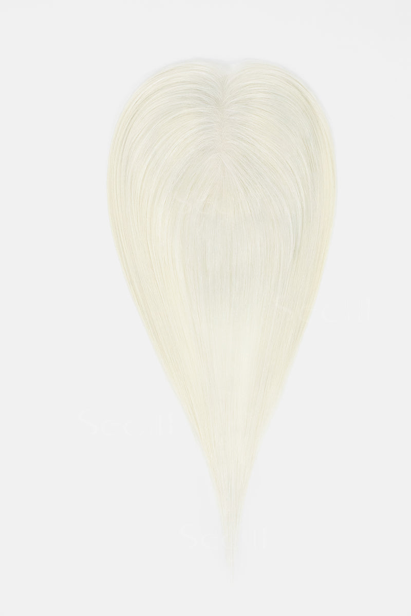 A heart-shaped hair extension or wig piece in a very light platinum blonde color, shown against a plain white background.