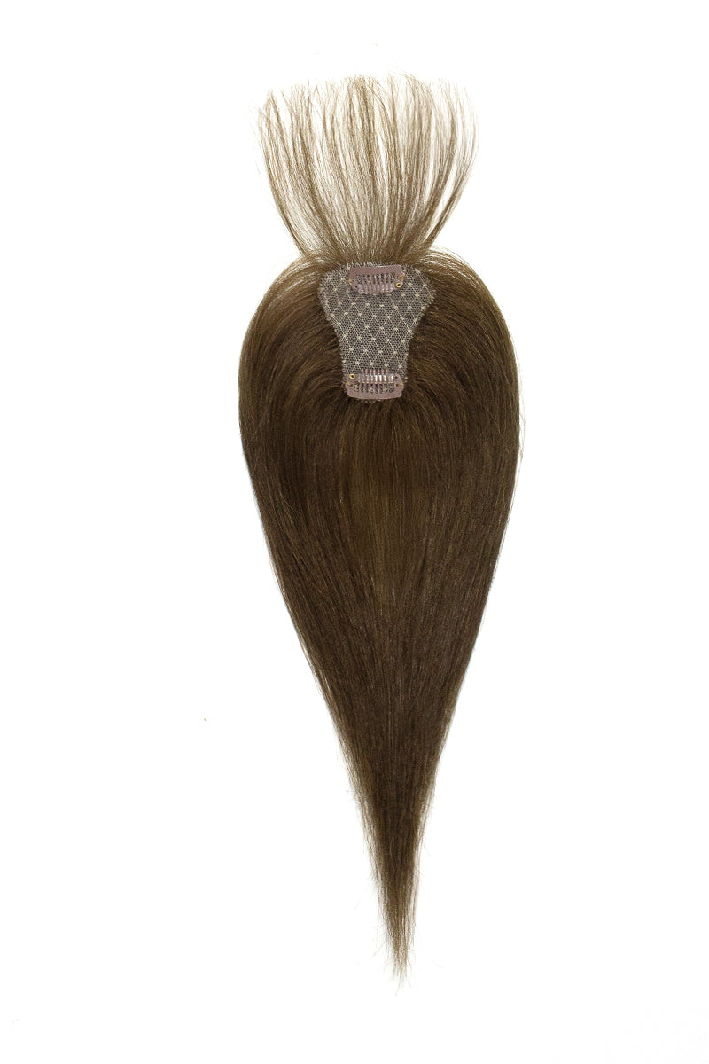 Brown hair topper with a clip on a white background