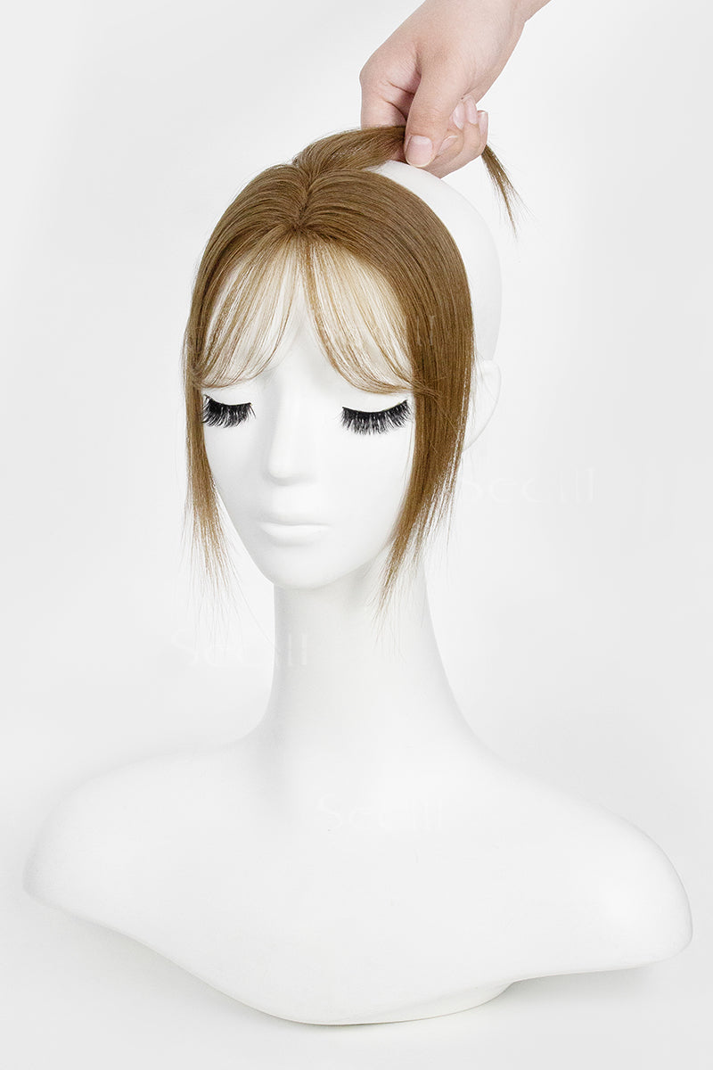 Mannequin head with a Magic Pixie Topper with Bangs Medium Ash Brown