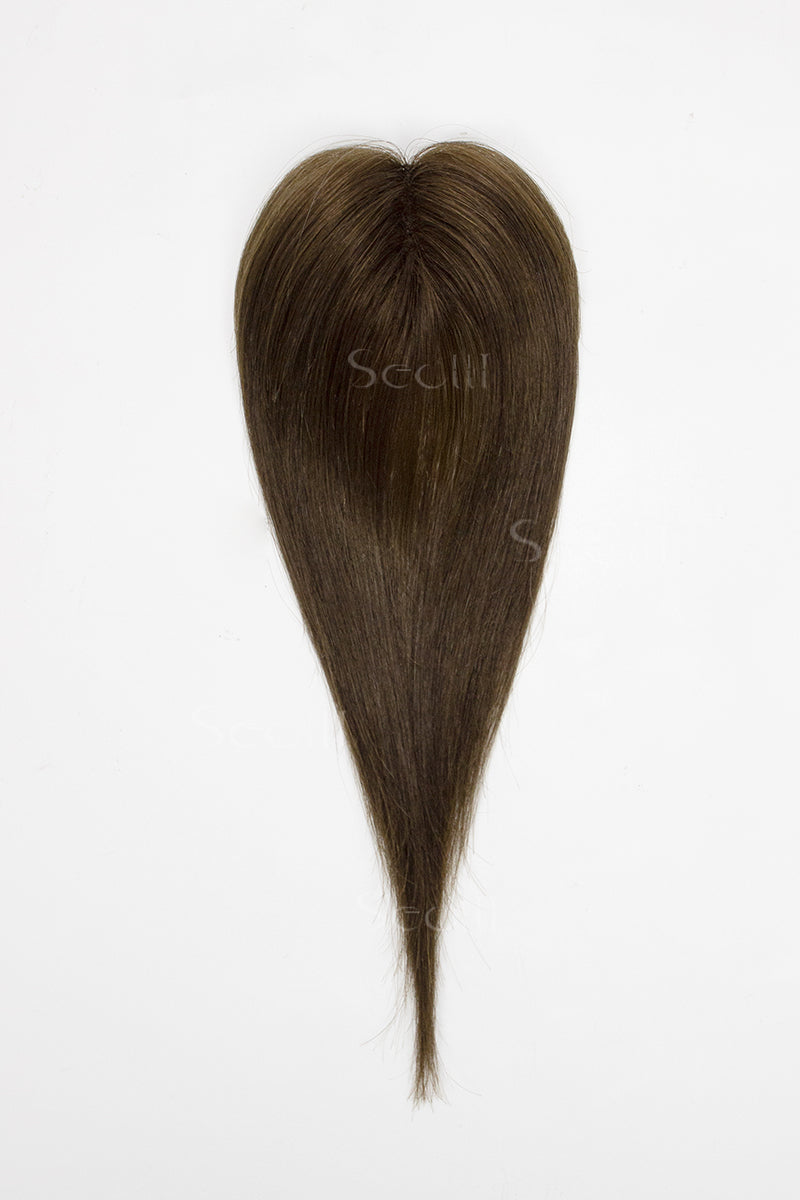 Brown hair topper on a white background