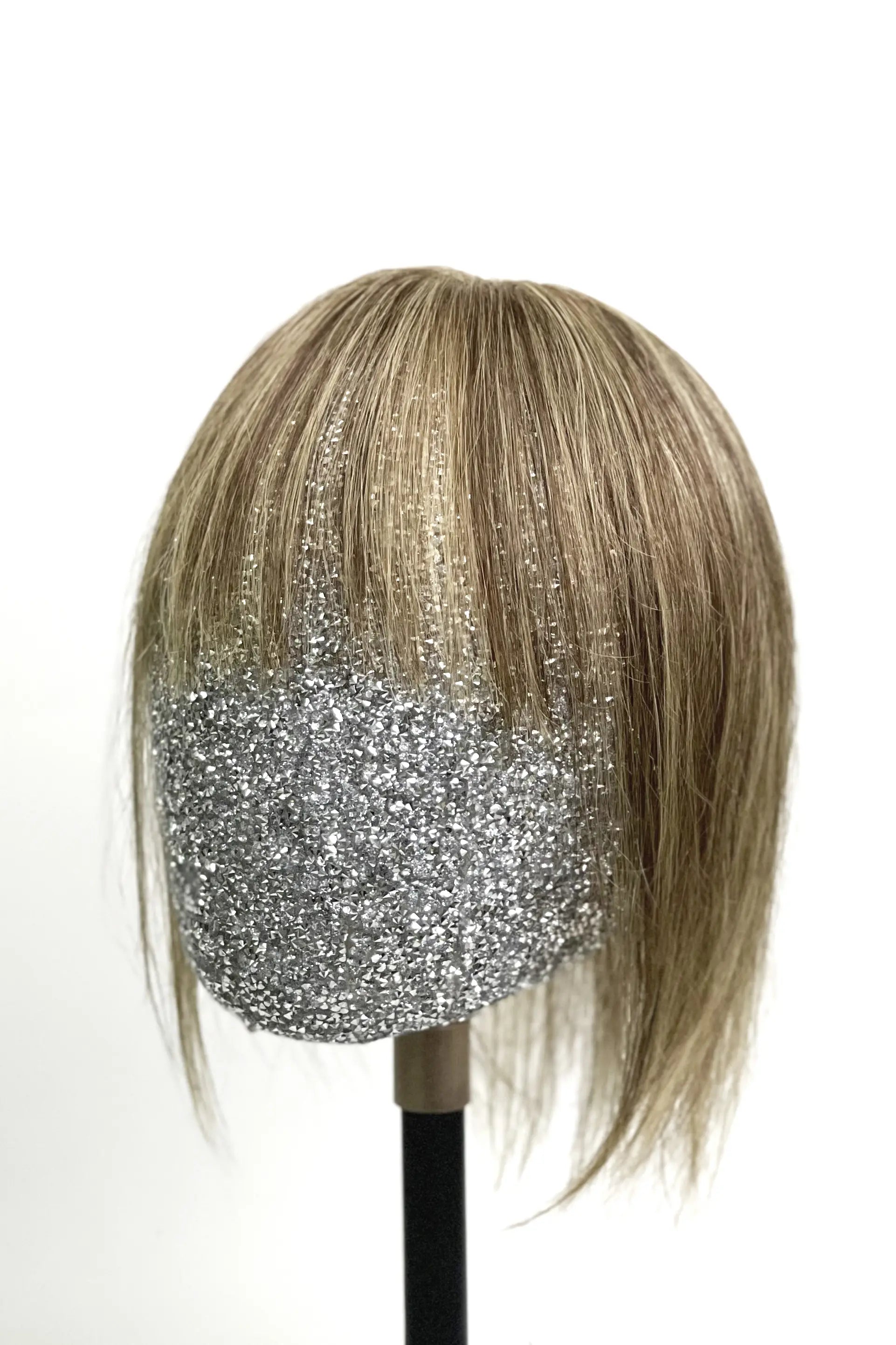 A mannequin head showcasing Mona-B Handmade Human Hair Topper with Bangs Medium Brown with Warm Highlights