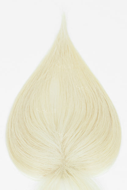 A teardrop-shaped swatch of light platinum blonde hair on a plain white background, showing the texture and color of the hair.