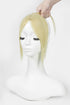 A blonde wig with side-swept bangs displayed on a white mannequin bust, with a hand lifting the hair at the top against a plain white background.