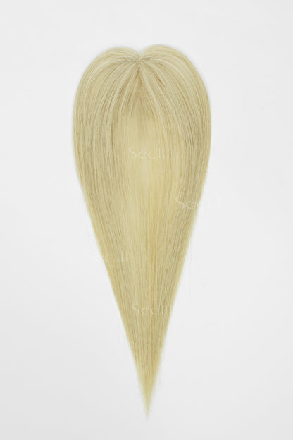 A heart-shaped hair extension piece with straight, fine synthetic-looking strands in a light blonde color, shown against a plain white background.