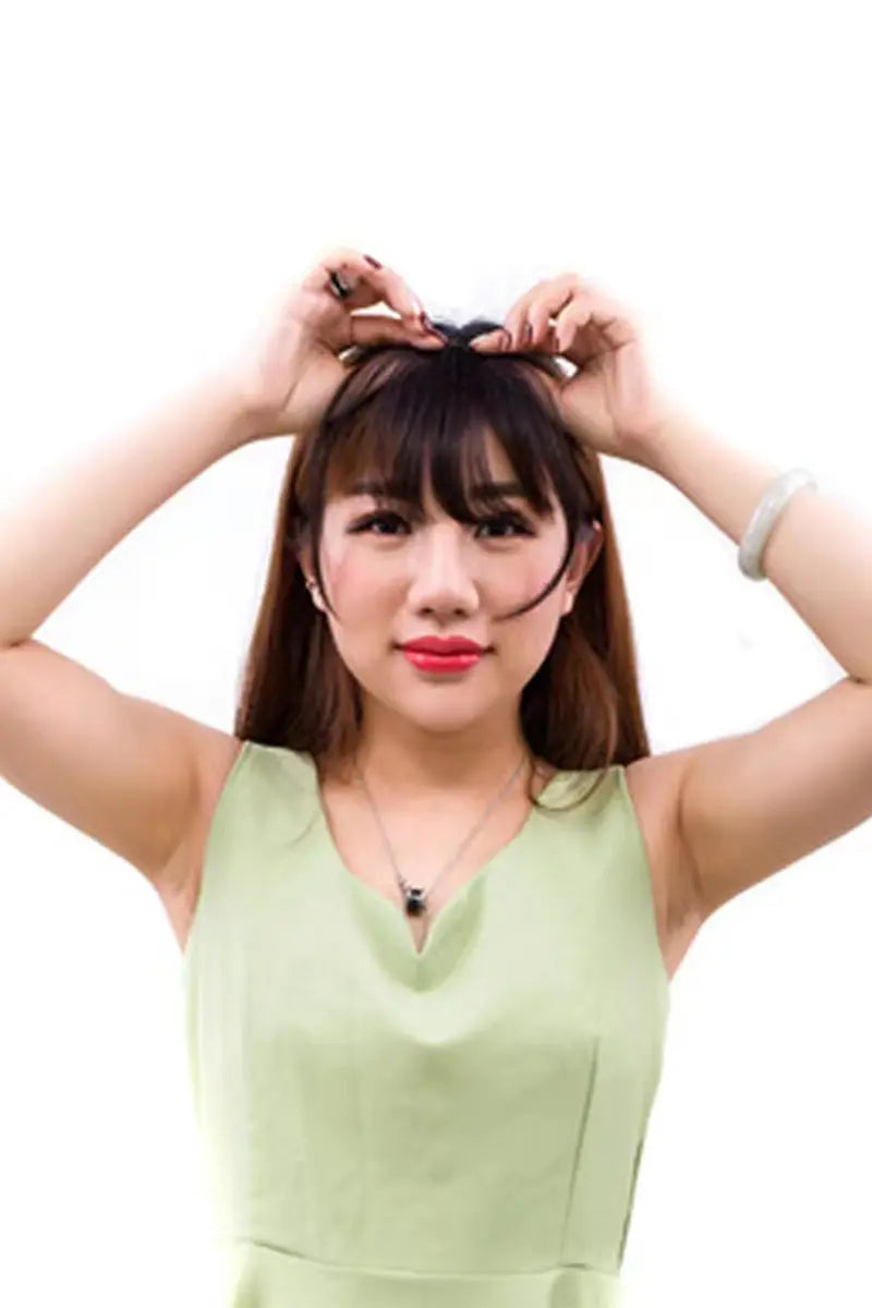 a woman try to wear a hair bangs