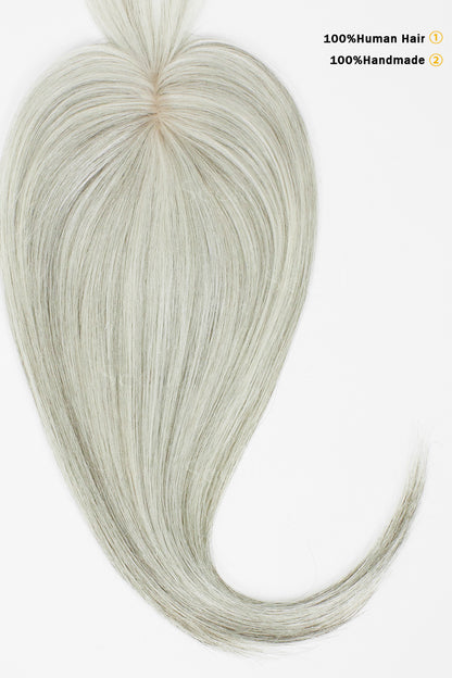 A bundle of long, straight synthetic or human hair extensions in a light ash blonde color, arranged in a heart shape with a tail, on a plain white background. Black text in the top right corner reads &