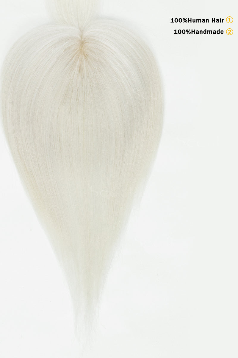 Close-up of a white wig cap with text indicating &