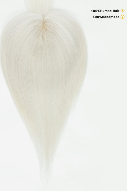 Close-up of a white wig cap with text indicating &