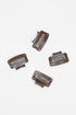 Four plastic hair combs on a white background