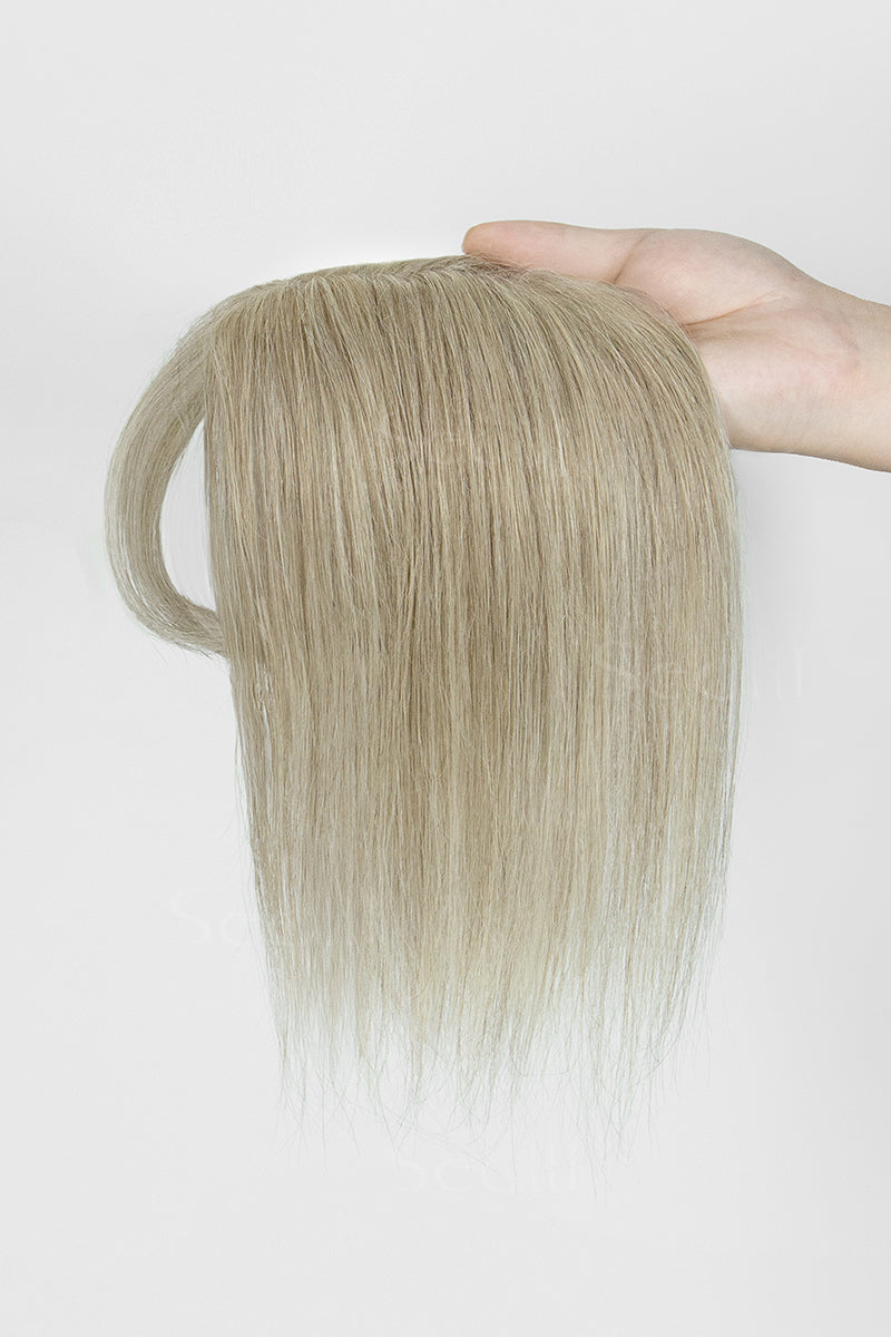 Hand holding a Beige Blonde 