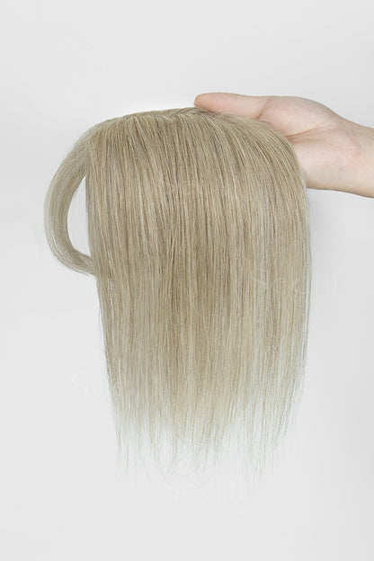 Hand holding a Beige Blonde 