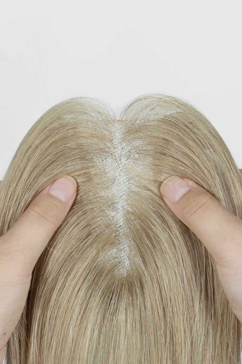 Hands parting a Beige Blonde 