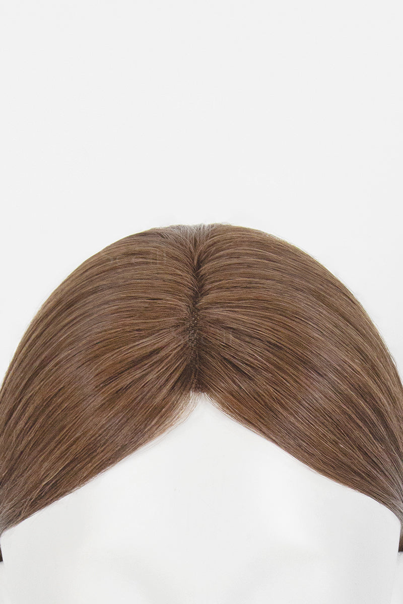 A close-up of a brown wig or hairpiece with a center part, shown against a plain white background.