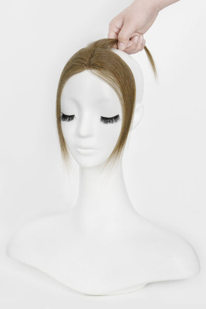 Mannequin head with a Magic Pixie Topper Light Chestnut Brown 