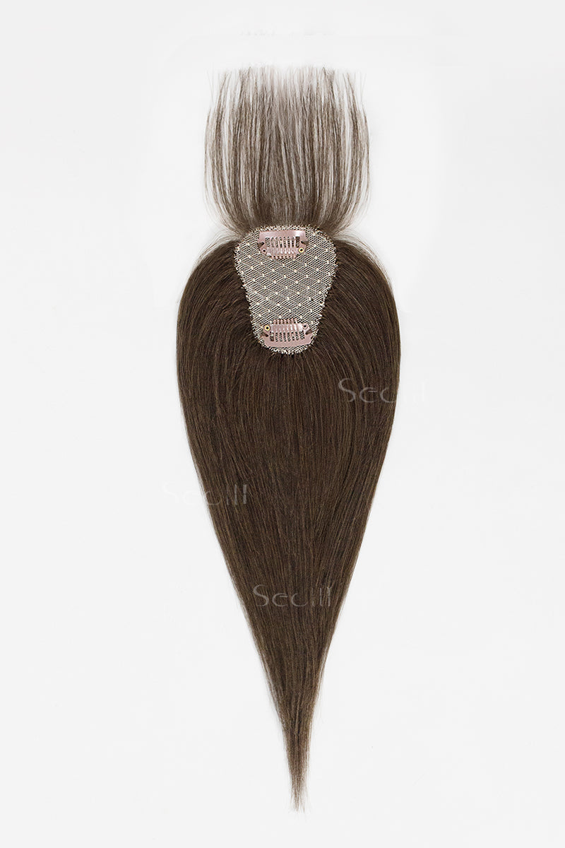 Hair topper with a clip on a white background