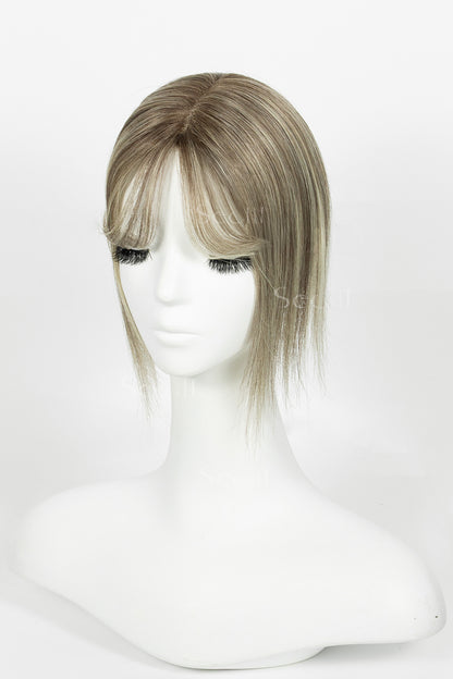 Mona-B human hair topper with bangs in brown blonde with medium brown root side view