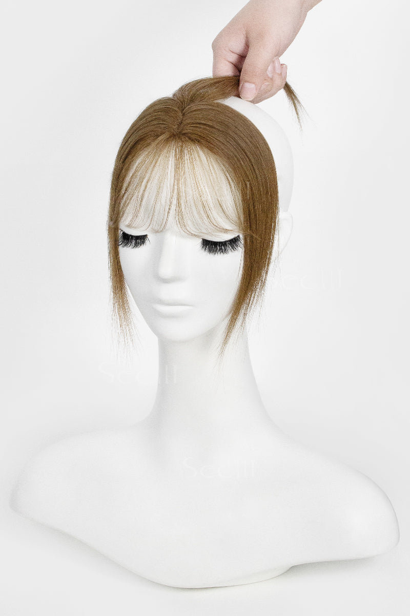 Mannequin head with a Magic Pixie Topper with Bangs Medium Ash Brown 