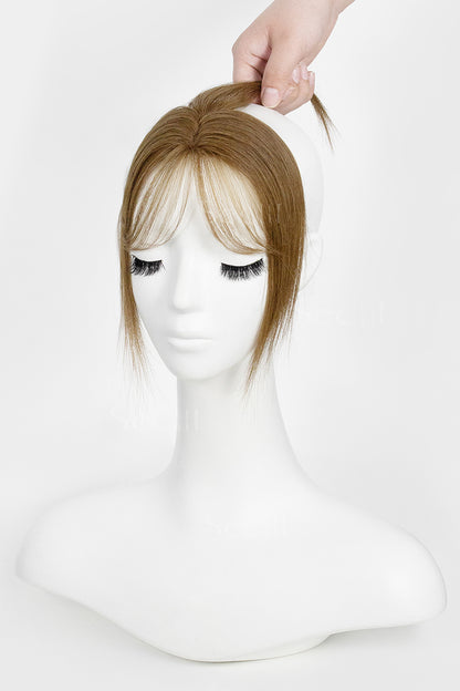 Mannequin head with a Magic Pixie Topper with Bangs Medium Ash Brown 