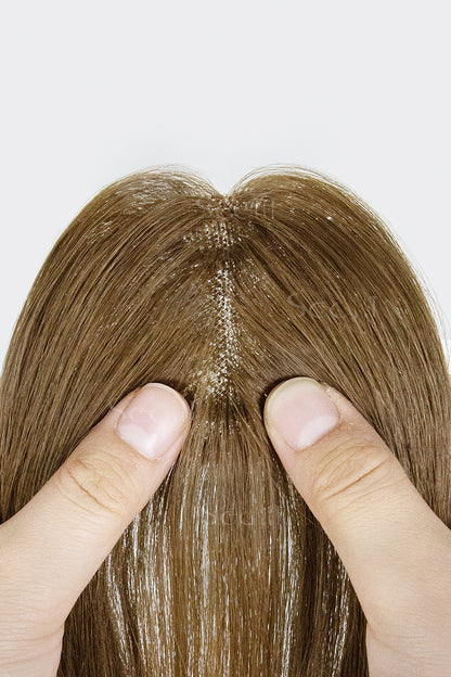 Close-up of a Magic Pixie Topper with Bangs Medium Ash Brown 