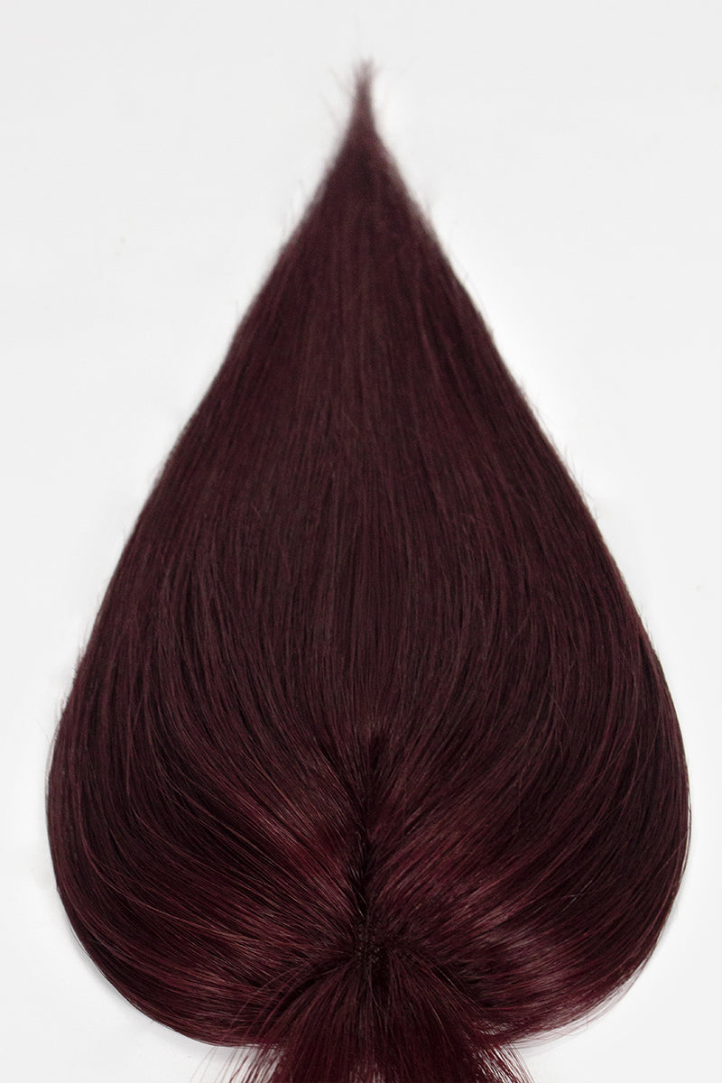 Dark burgundy hair topper on a white background
