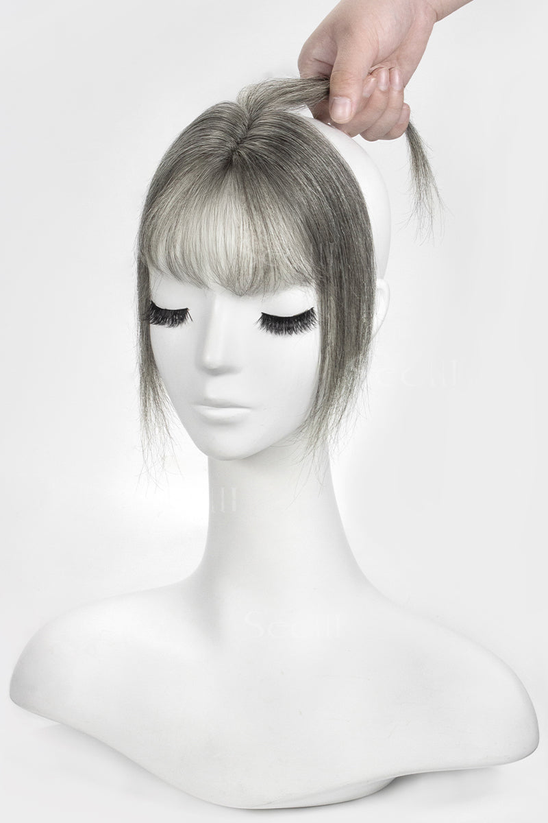 Mannequin head with a Magic Pixie Topper with Bangs 