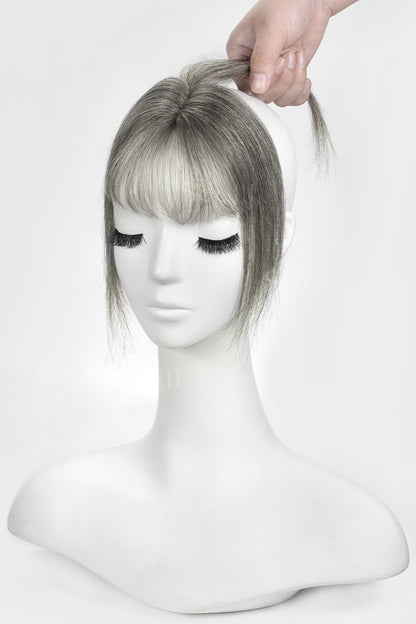 Mannequin head with a Magic Pixie Topper with Bangs 