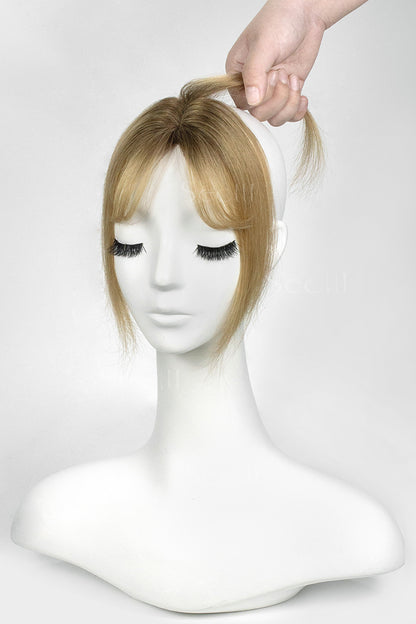 Mannequin head with a Magic Pixie Topper with Bangs Medium Brown Dark Blonde 