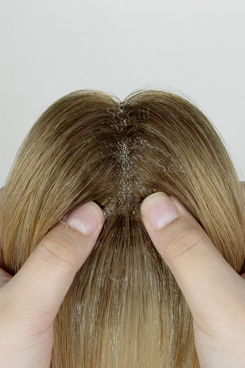 Close-up of a Magic Pixie Topper with Bangs Medium Brown Dark Blonde 
