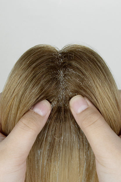 Close-up of a Magic Pixie Topper with Bangs Medium Brown Dark Blonde 