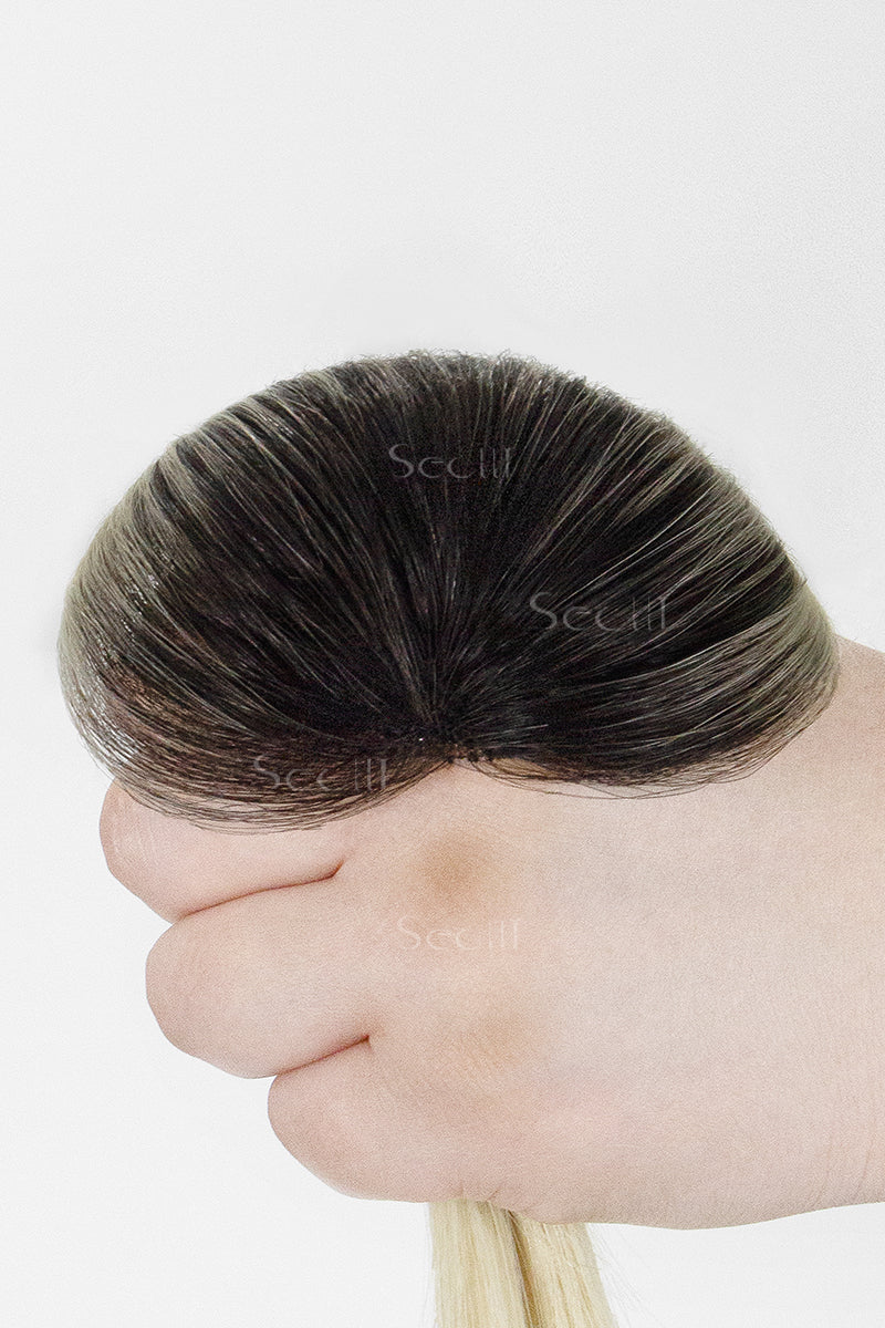 Hand holding a Magic Pixie Topper Natural Black Roots with Lightest Blonde 