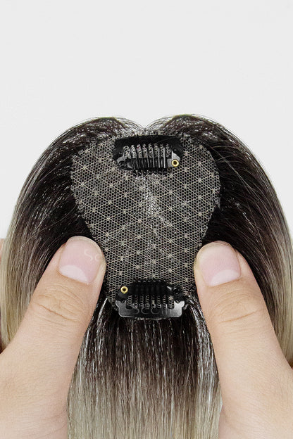 Close-up of a Magic Pixie Topper Natural Black Roots with Lightest Blonde 