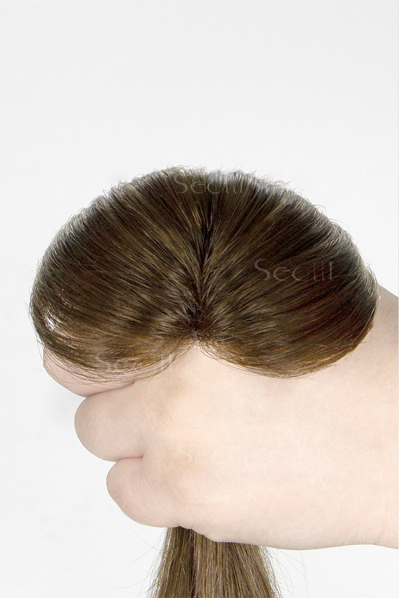 topper being held by a hand on a white background