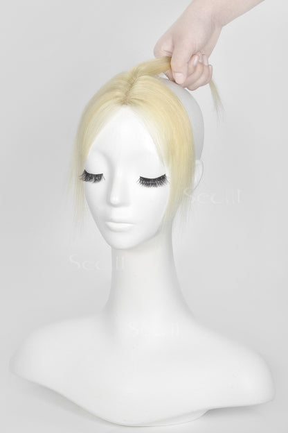 Mannequin head with Magic Pixie Topper Lightest Blonde 