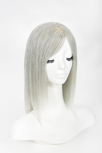 Silver wig on a mannequin head against a white background