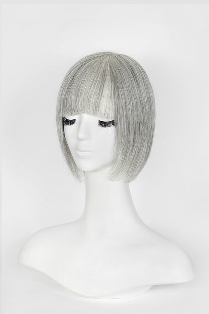 Silver-gray short bob wig with blunt bangs displayed on white mannequin head, front view, light gray background