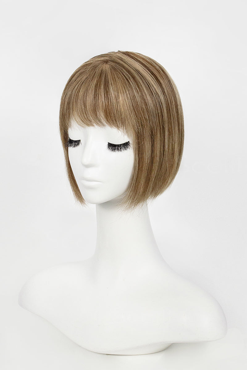 Mannequin head with a brown wig on a white background