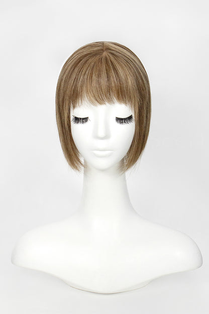 Mannequin head with a brown wig on a white background