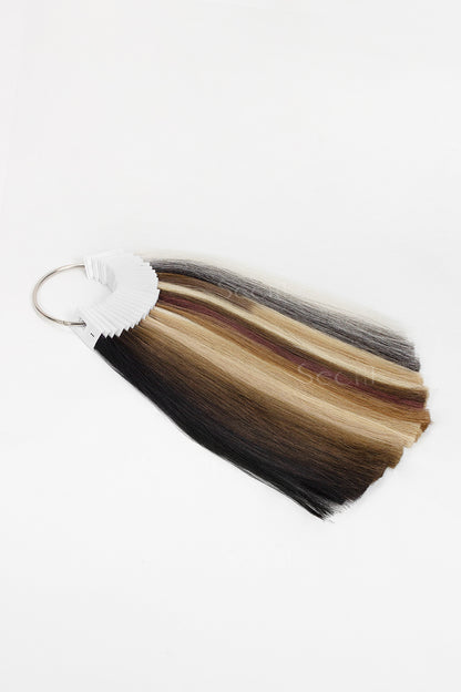 Multicolored tassel keychain on a white background