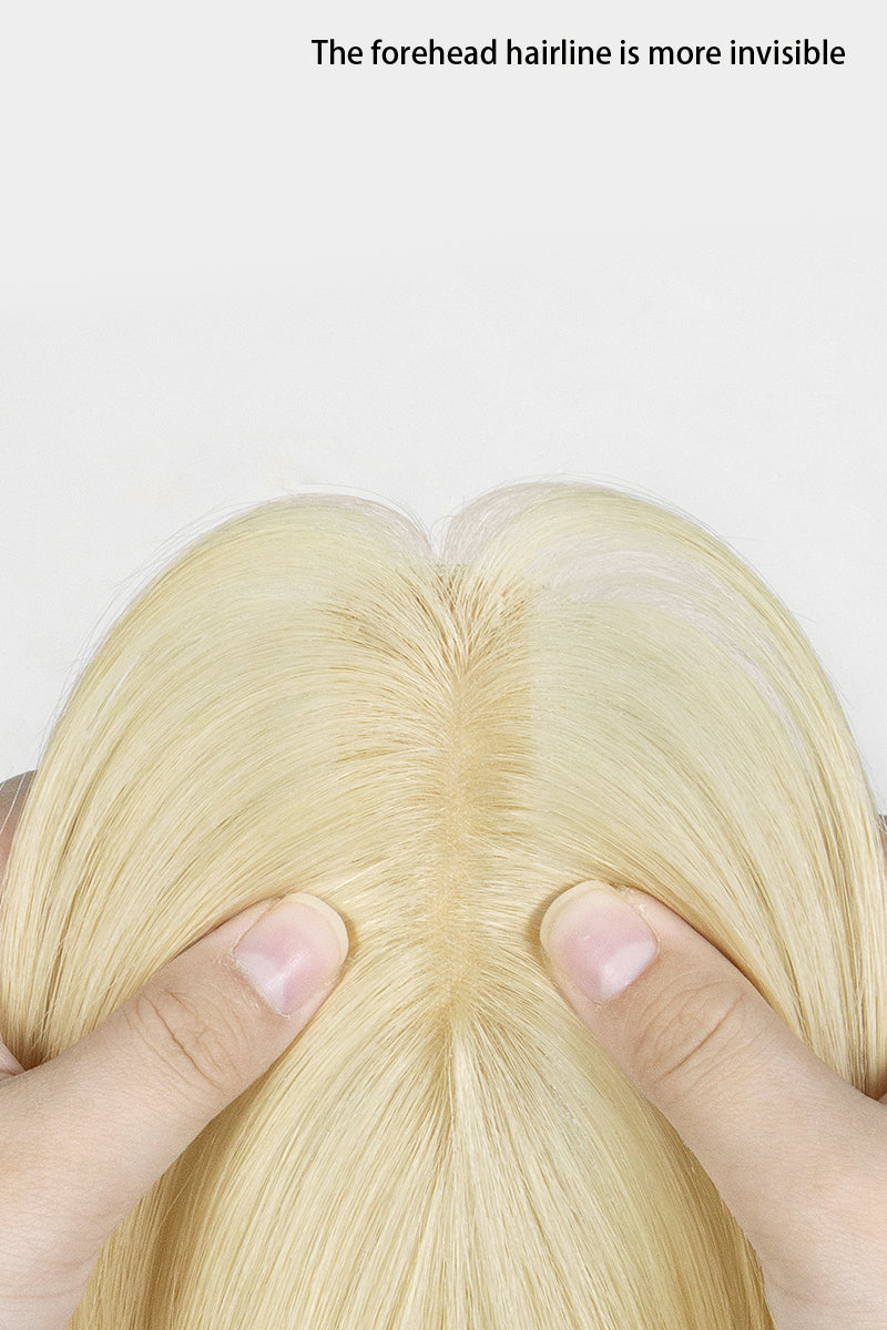 Hera Human Hair and Handmade Topper with Bangs being held with fingers on a white background